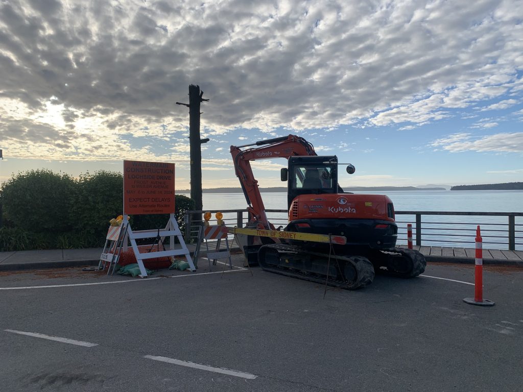 Construction sign and digger on Lochside Drive