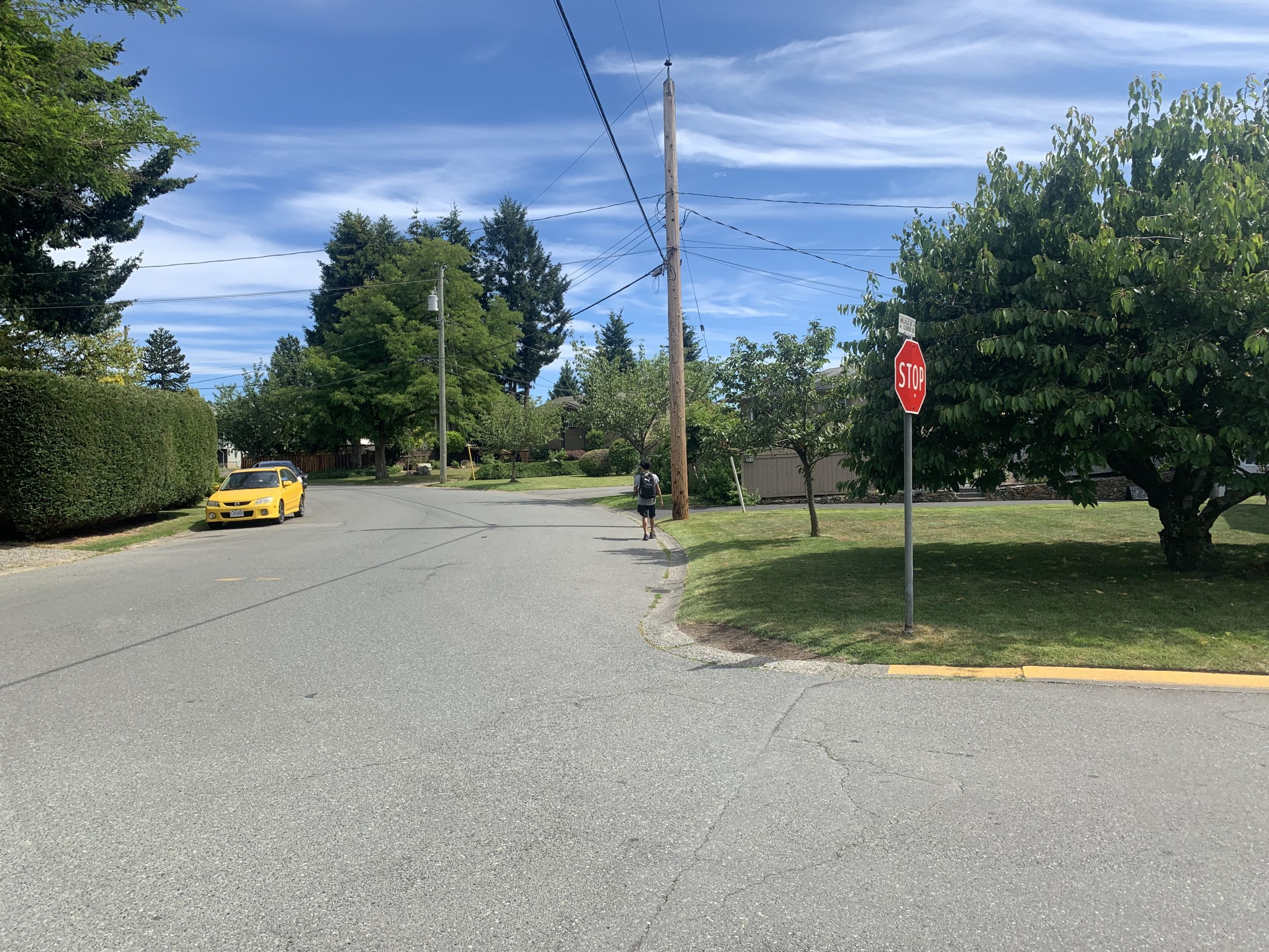 Melville drive with student walking